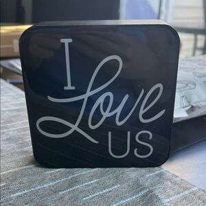 Black Decorative Block with 'I Love Us' Text